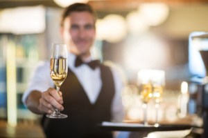 Seasonal Waiting Staff offering champagne