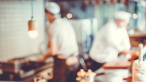 Kitchen Porter cleaning dishes